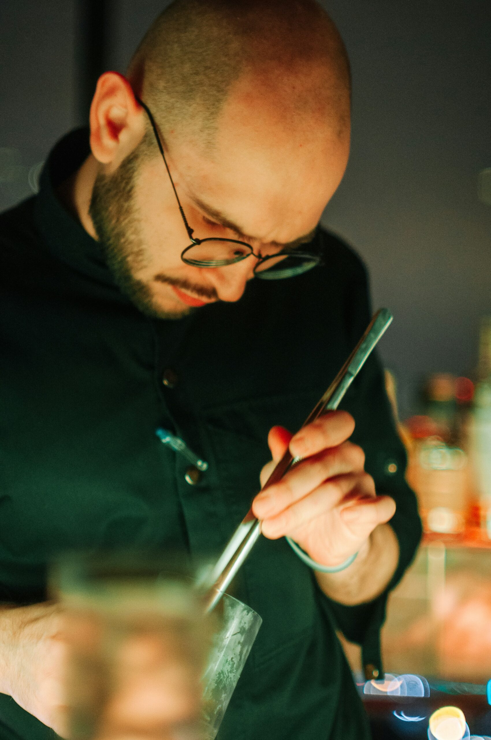 Licensed bartender in duty serving drink